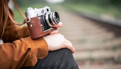 photographer-in-brown-jacket-with-retro-camera-2021-09-04-10-01-34-utc.jpg